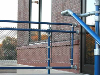 Chain link stair railing with blue tension bar and blue top rail.