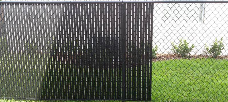 Black single wall bottom locking slats for black chain link fence.