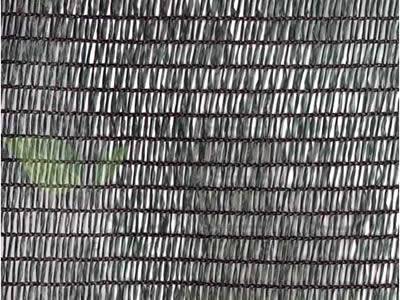 Big holes black woven fabric net and the chain link fence behind.