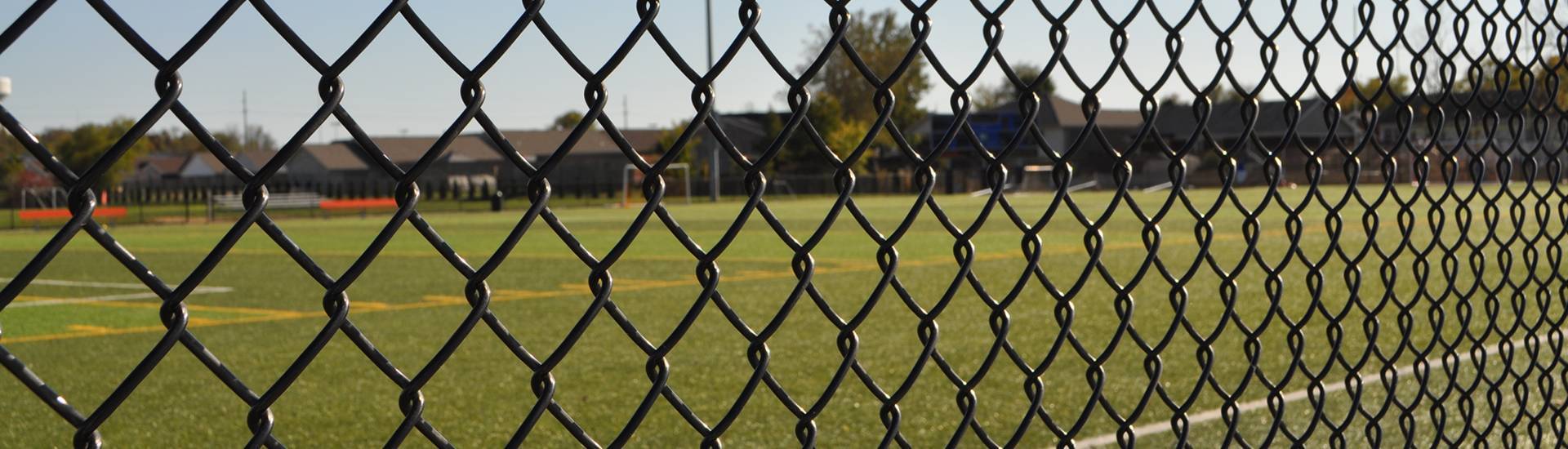 Black color chain link fences are installed in the stadium.