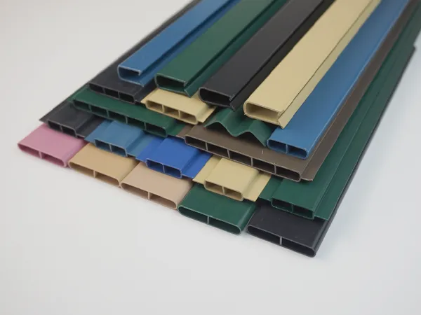 Chain link fence slats in a variety of colors and types, stacked together.