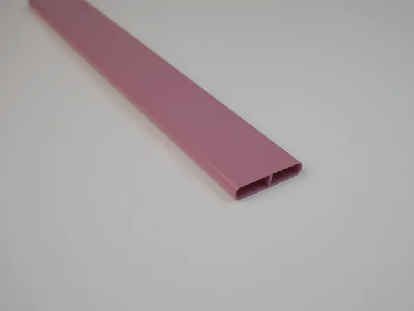 A finished tubular chain link fence slat in pink