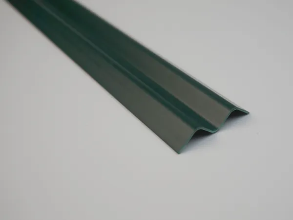 A finished wave-type chain link fence slat in forest green