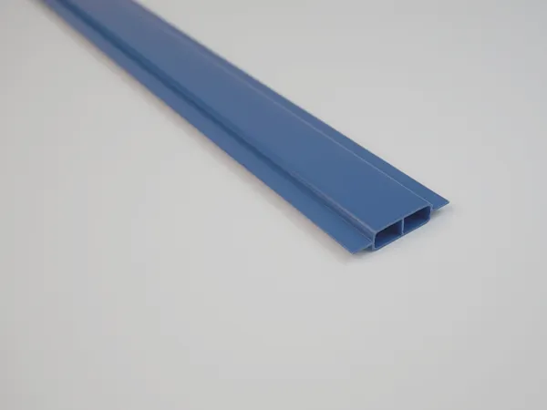 A finished wing-type chain link fence slat in dark blue