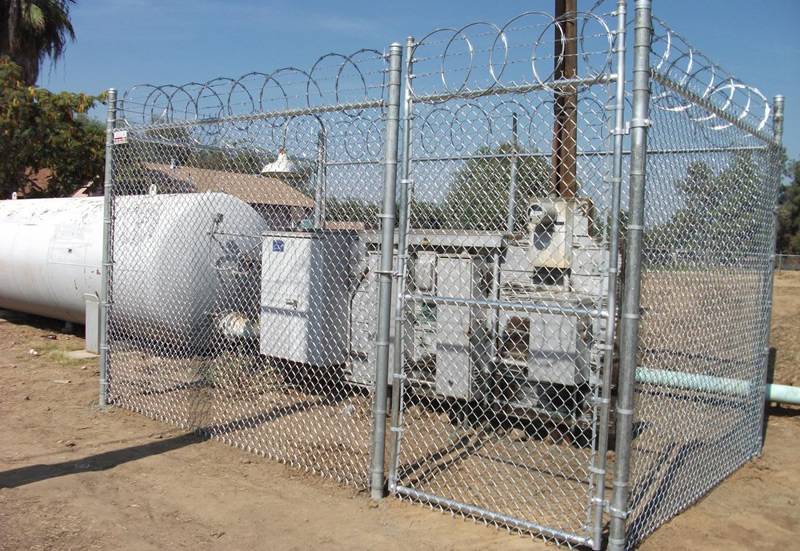 Important equipment enclosed by high security chain link fence.