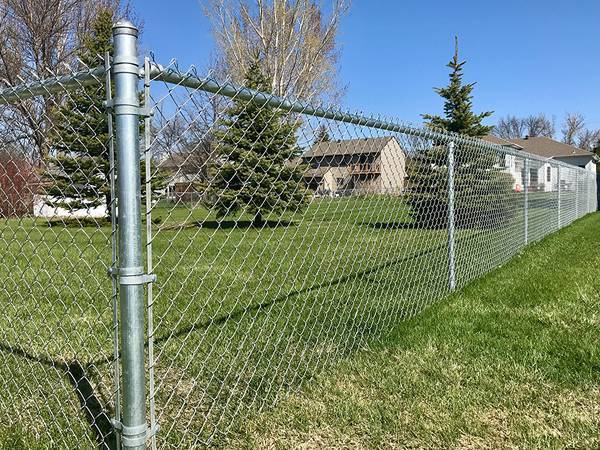 Residential stainless steel chain link fence.